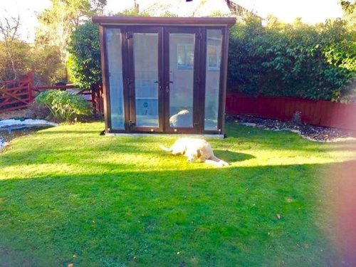 7x8ft Pod with brown external wood effect cladding and hydro bath