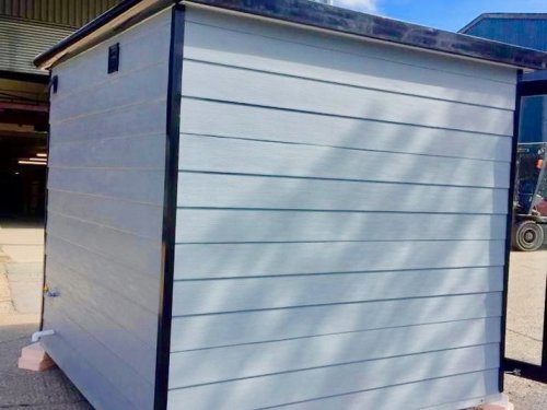 8x8ft With a Deluxe and composite wood effect cladding with black glazing frames