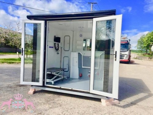 8x8ft With a Deluxe and composite wood effect cladding with black glazing frames