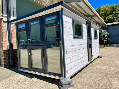 Large grey pod with black glazing