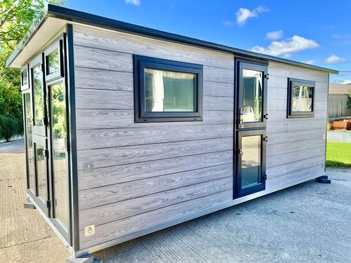 Large grey pod with black glazing