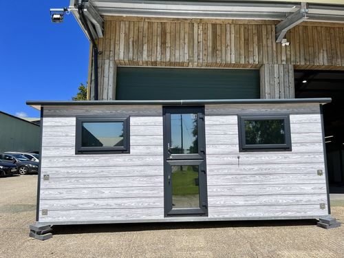 Large grey pod with black glazing