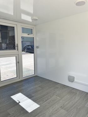 Large grey pod with black glazing