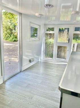 Large grey pod with black glazing
