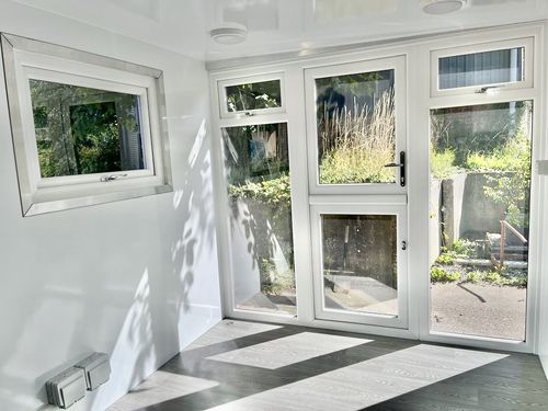 Large grey pod with black glazing