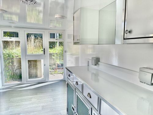 Large grey pod with black glazing